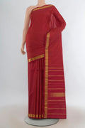 Pure Silk Red Kanjivaram Saree with Checked design on the body and Zari Border.  displayed on a mannequin