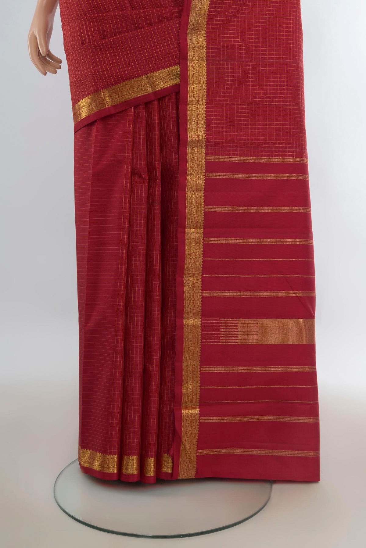 Pleats and pallu of Pure Silk Red Kanjivaram Saree with Checked design on the body and Zari Border. 