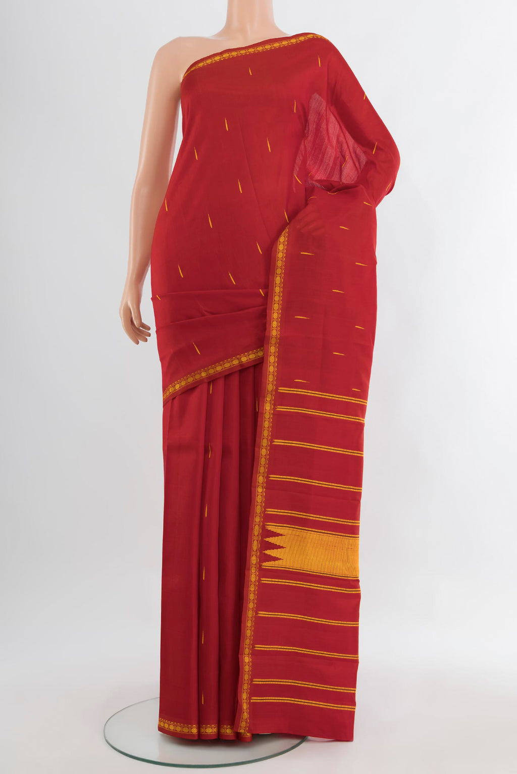 Red Kanchipuram Silk Saree with Thread Butta on the body and Silk Border.  displayed on a mannequin