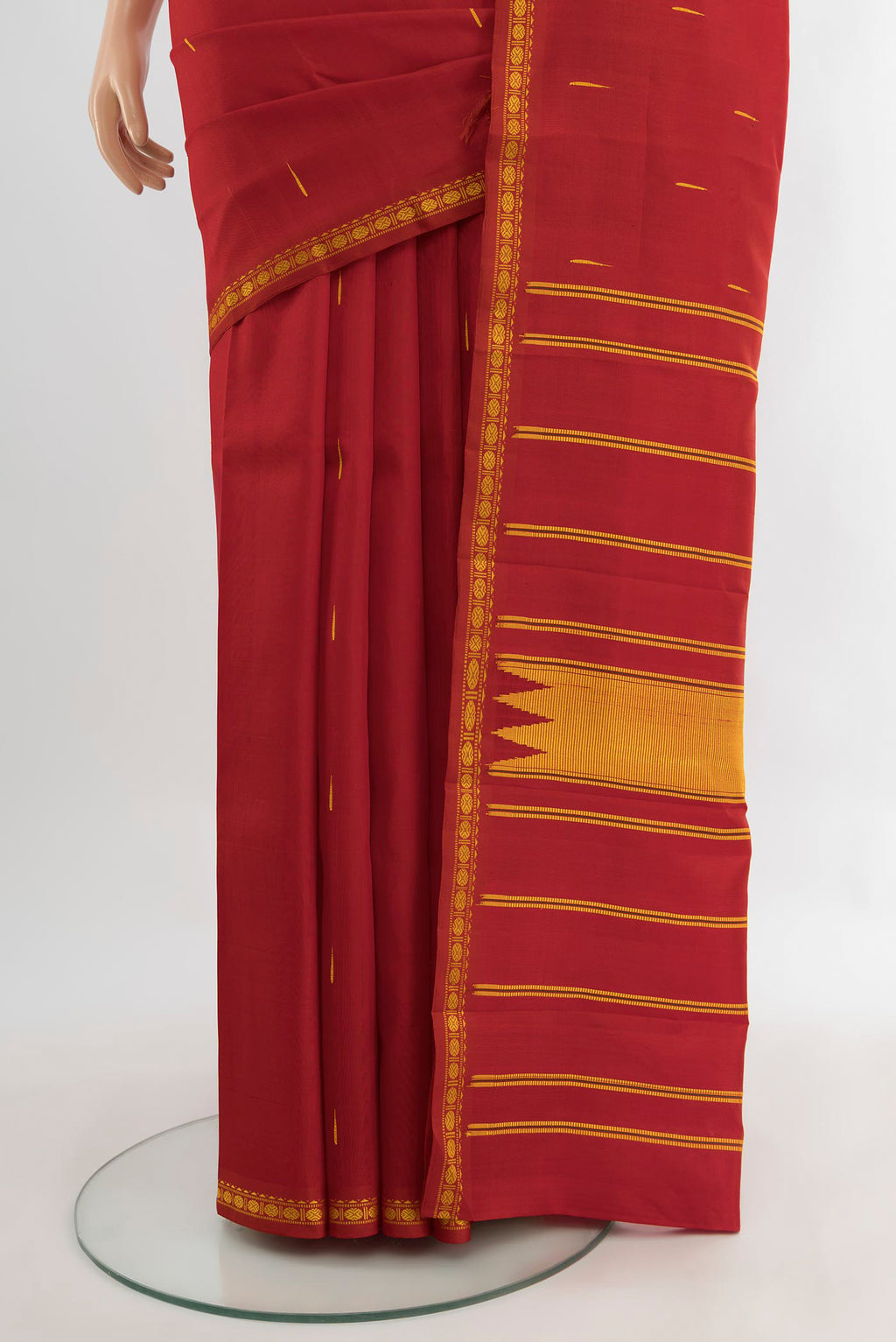 Pleats and pallu of Red Kanchipuram Silk Saree with Thread Butta on the body and Silk Border. 