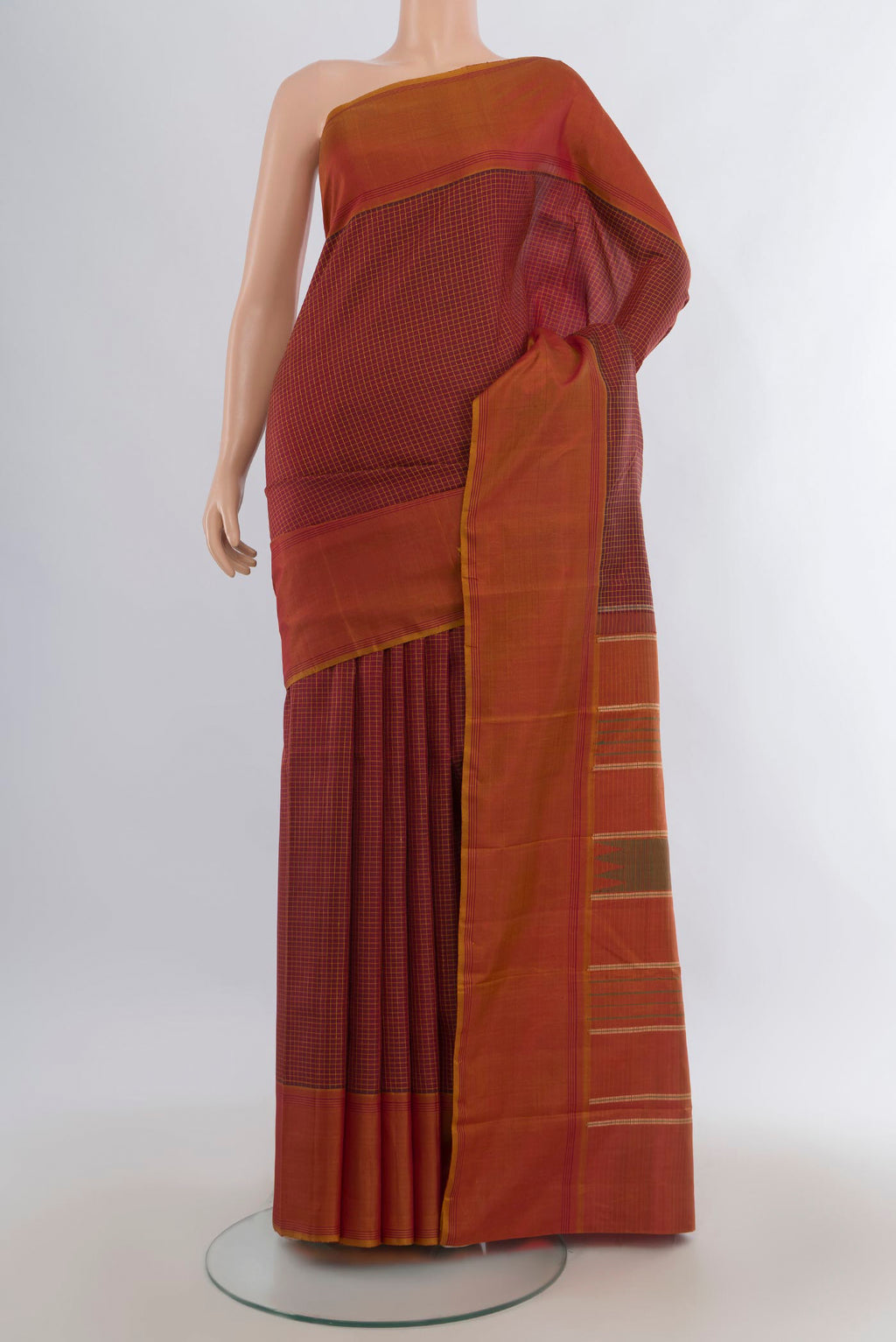 Pure Silk Maroon Kanchipuram Saree with Checked design on the body and Plain Border.  displayed on a mannequin
