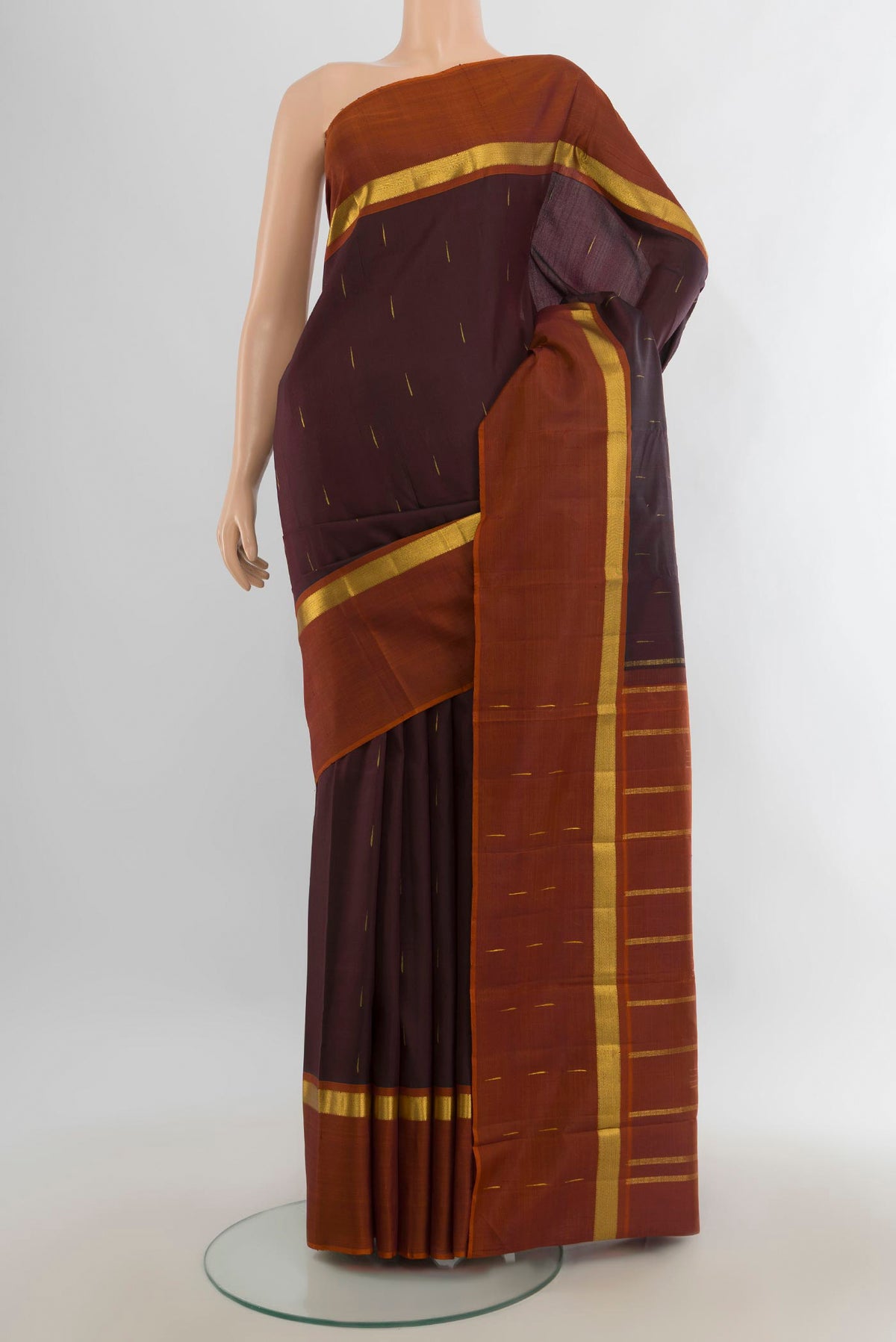 Pure Silk Pure Zari Coffee Brown Kanchipuram Saree with Zari Butta on the body and Silk Border.  displayed on a mannequin