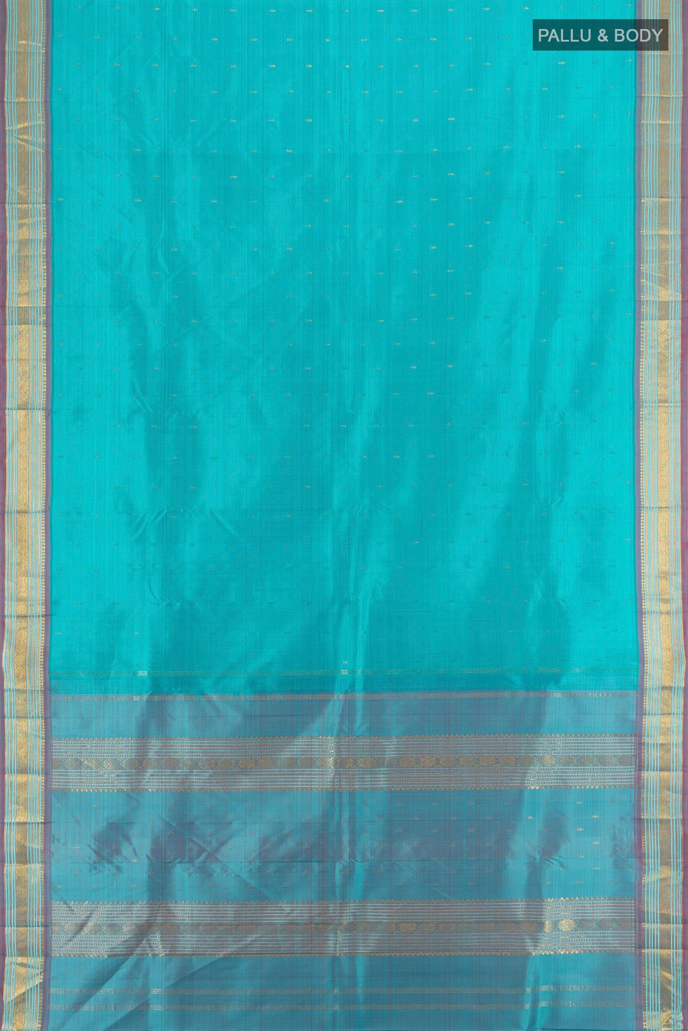 Flat view of Light Blue Kanchipuram Silk Saree with Zari Butta on the body and Zari Border. 