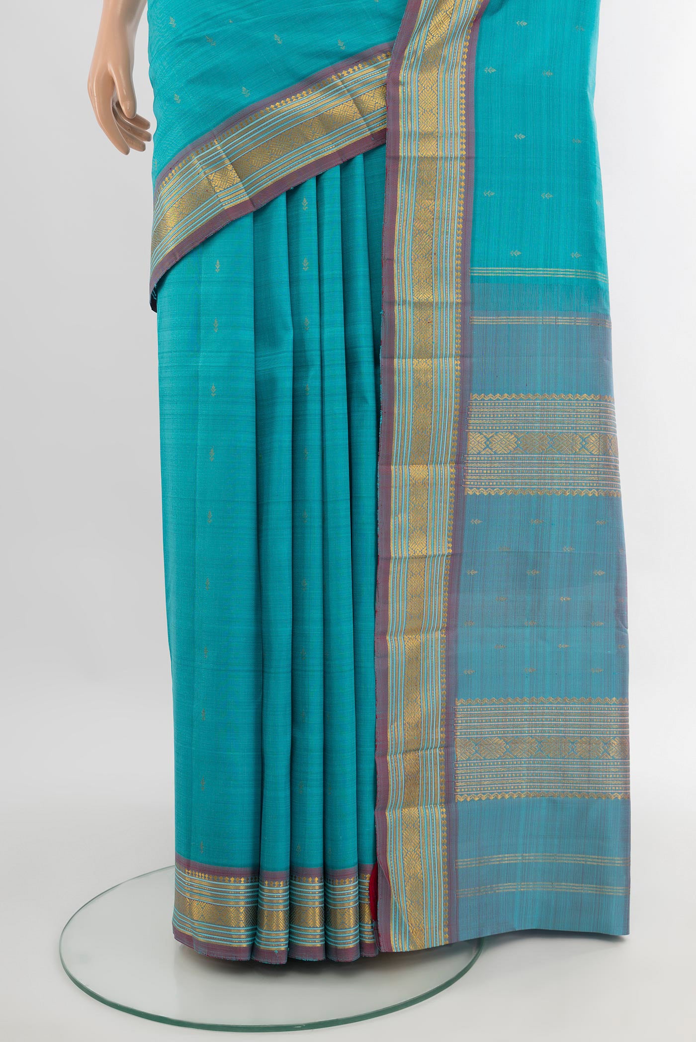 Pleats and pallu of Light Blue Kanchipuram Silk Saree with Zari Butta on the body and Zari Border. 