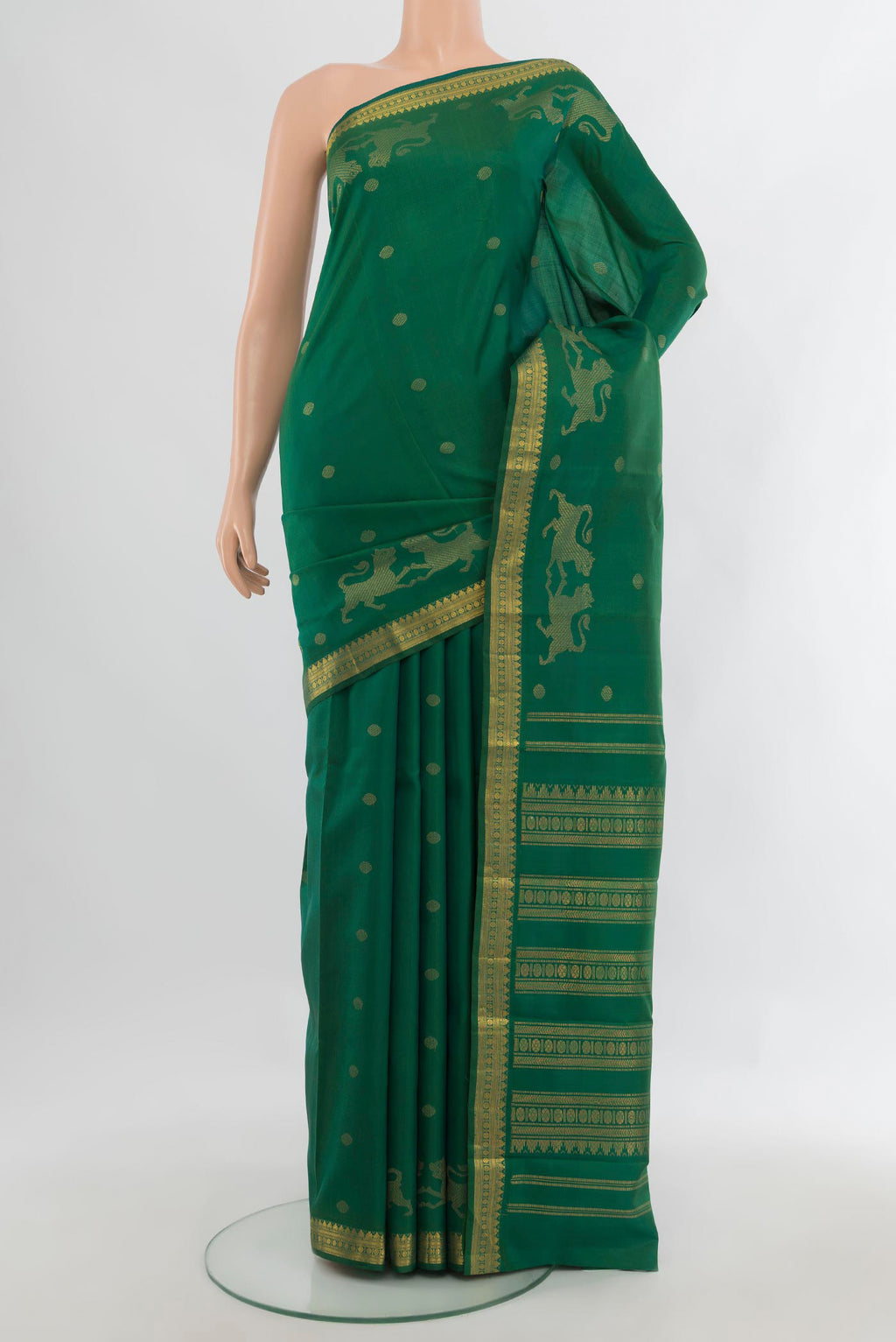 Pure Silk Green Kanjivaram Saree with Zari Butta on the body and Zari Border.  displayed on a mannequin