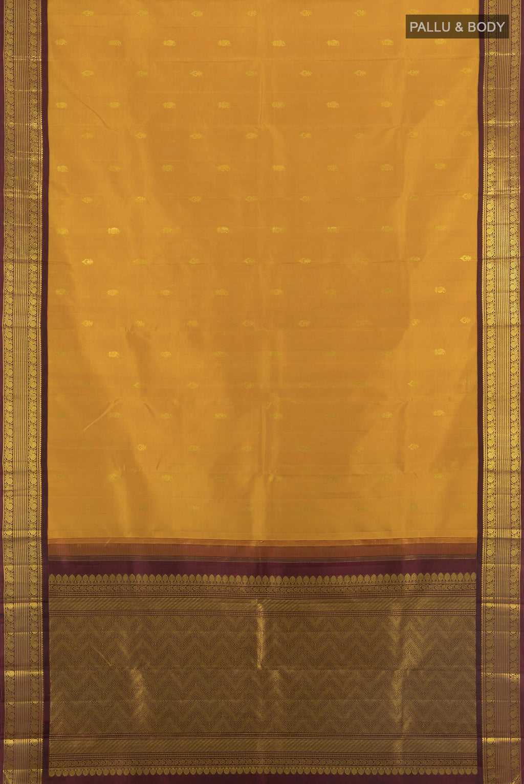 Flat view of Mustard Kanchipuram Silk Saree with Zari Butta on the body and Zari Border. 