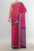 Pure Silk Pure Zari Rose pink Kanchipuram Saree with Zari Butta on the body and Zari Border.  displayed on a mannequin