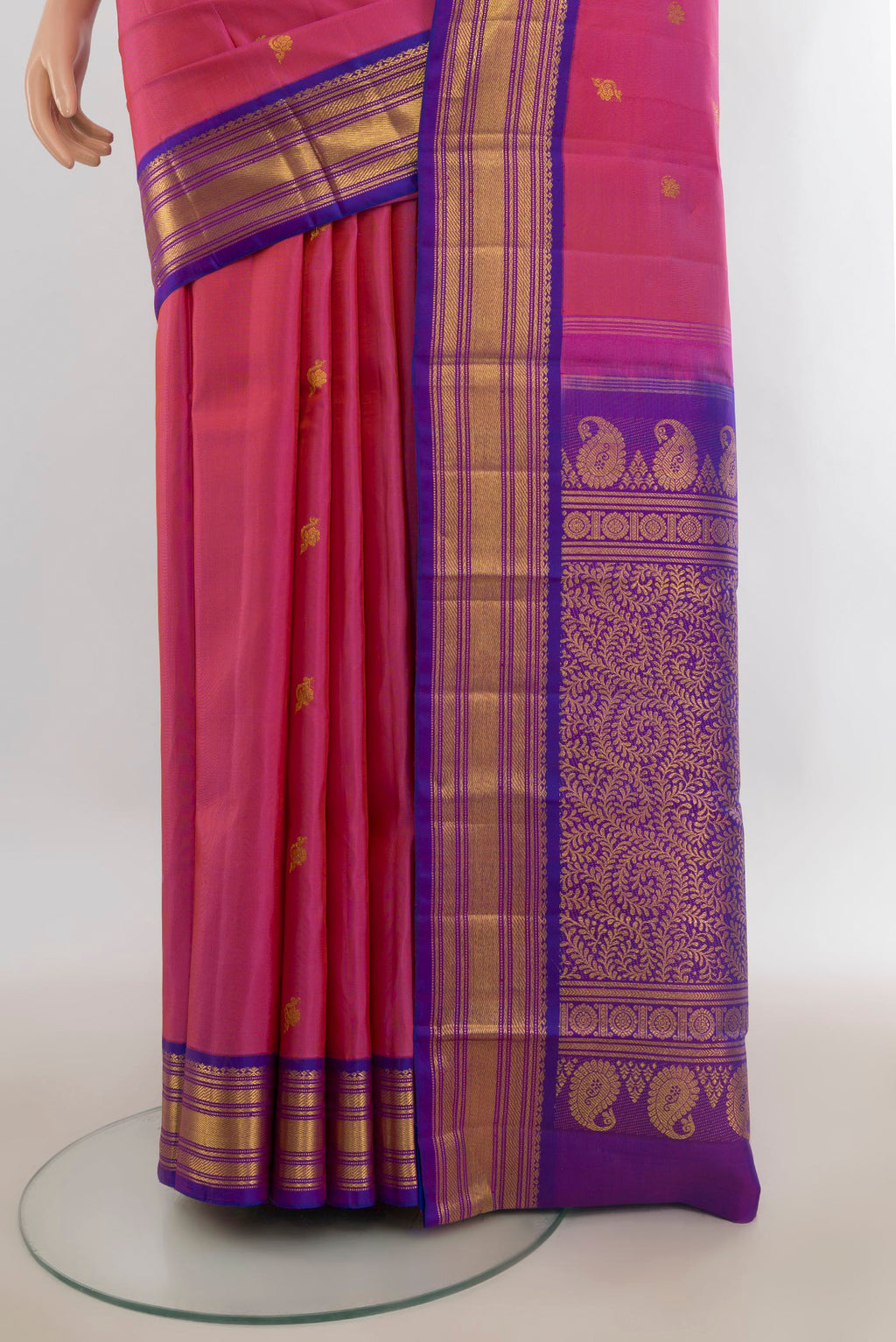 Pleats and pallu of Pure Silk Pure Zari Rose pink Kanchipuram Saree with Zari Butta on the body and Zari Border. 