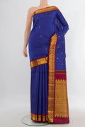 Pure Silk Dark Blue Kanchipuram Saree with Zari Butta on the body and Zari Border.  displayed on a mannequin