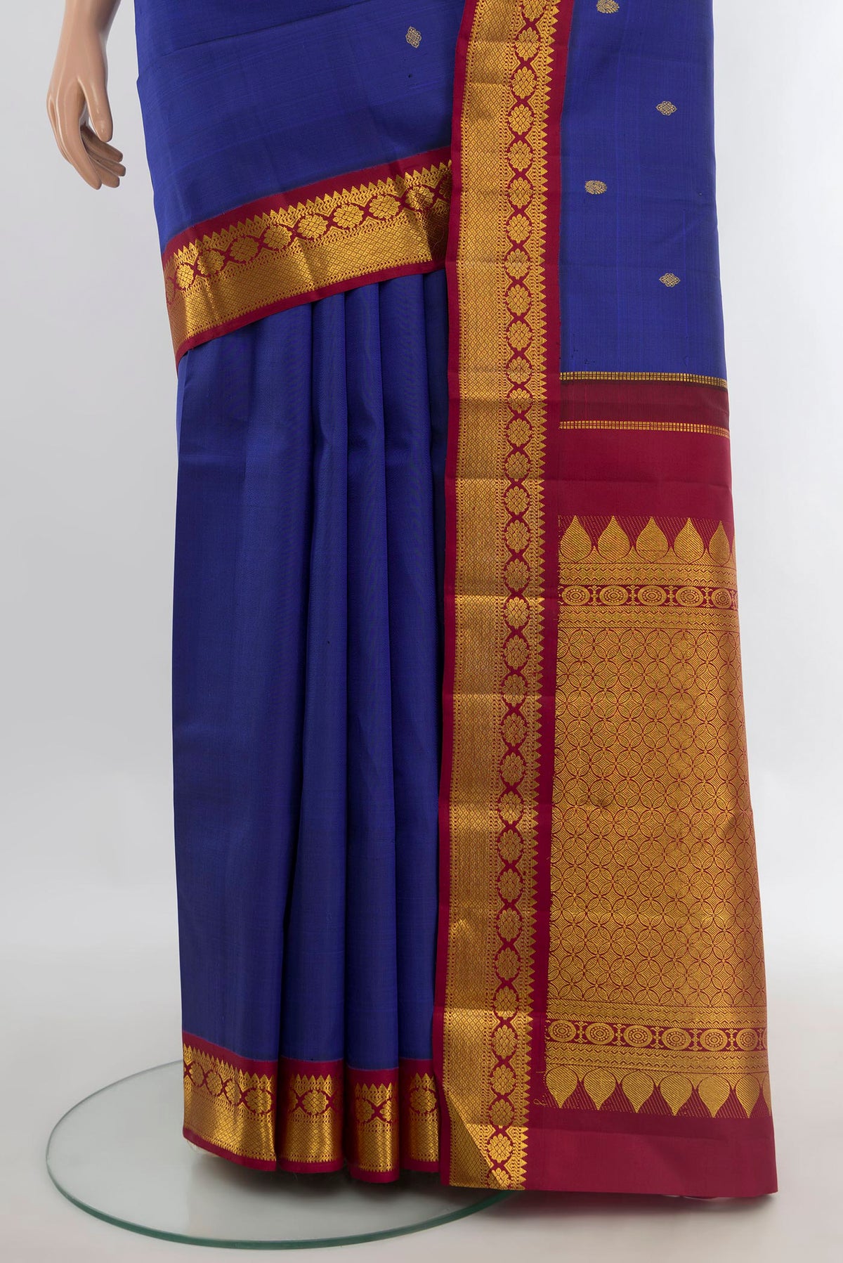 Pleats and pallu of Pure Silk Dark Blue Kanchipuram Saree with Zari Butta on the body and Zari Border. 