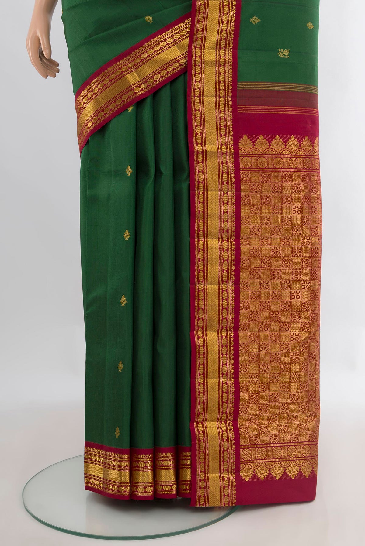 Pleats and pallu of Pure Silk Pure Zari Bottle Green Kanchipuram Saree with Zari Butta on the body and Zari Border. 