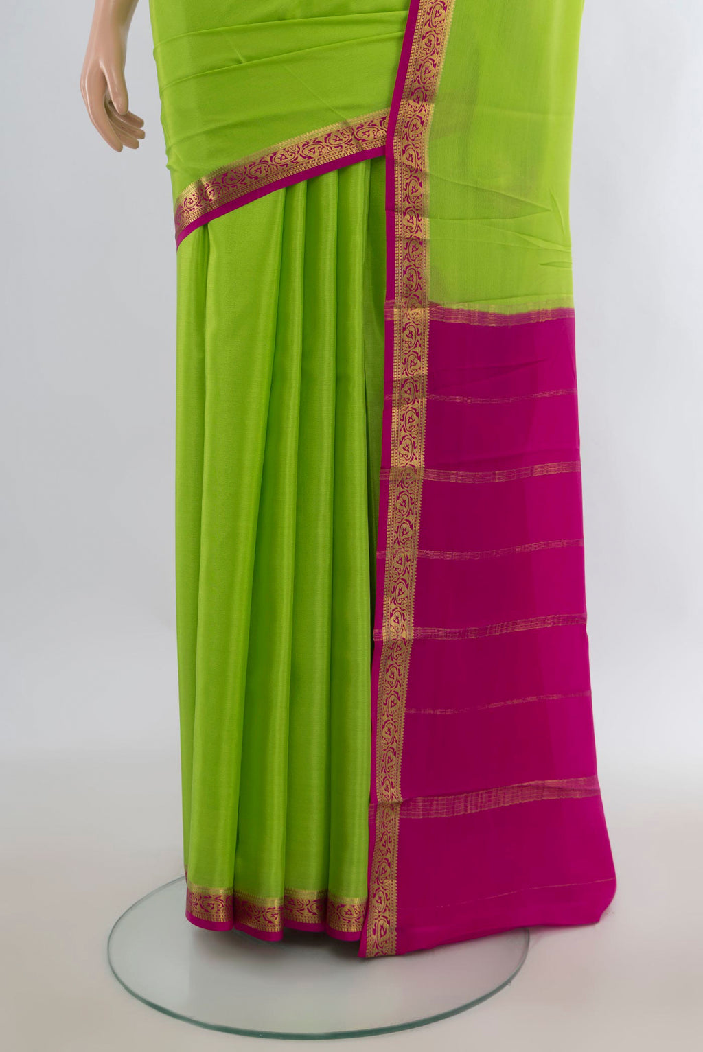 Pleats and pallu of Parrot Green Mysore Crepe Saree with Plain Body and Zari Border. 