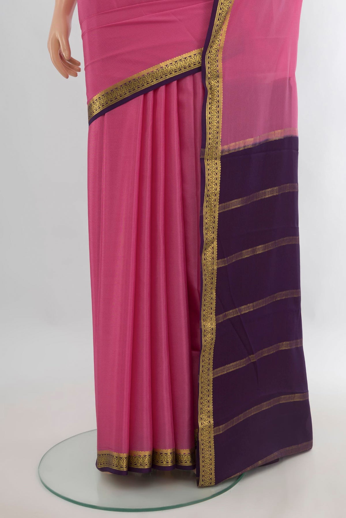 Pleats and pallu of Rose pink Mysore Crepe Saree with Plain Body and Zari Border. 
