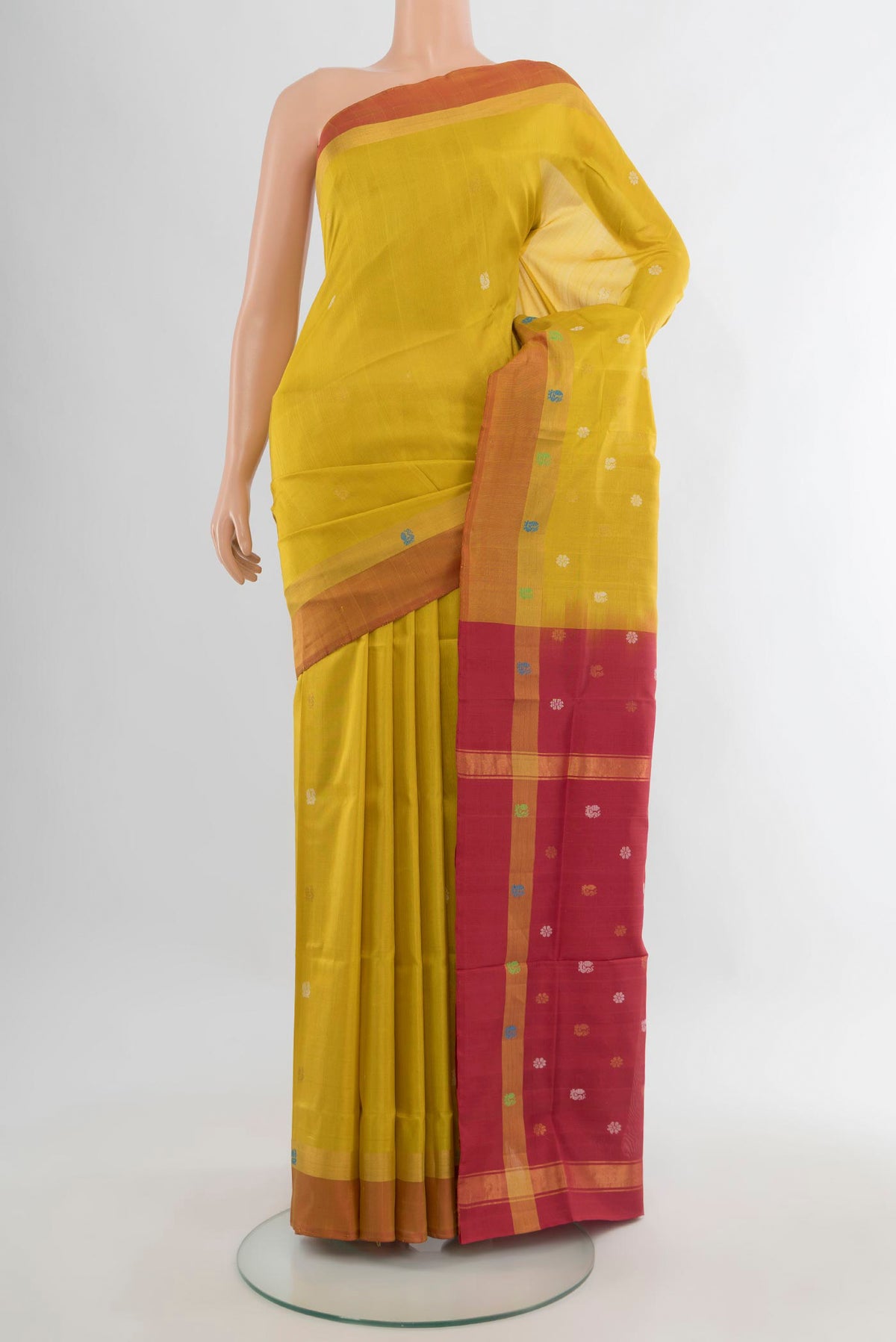 Pure Silk Lemon Yellow Uppada Saree with Zari Butta on the body and Zari Border.  displayed on a mannequin