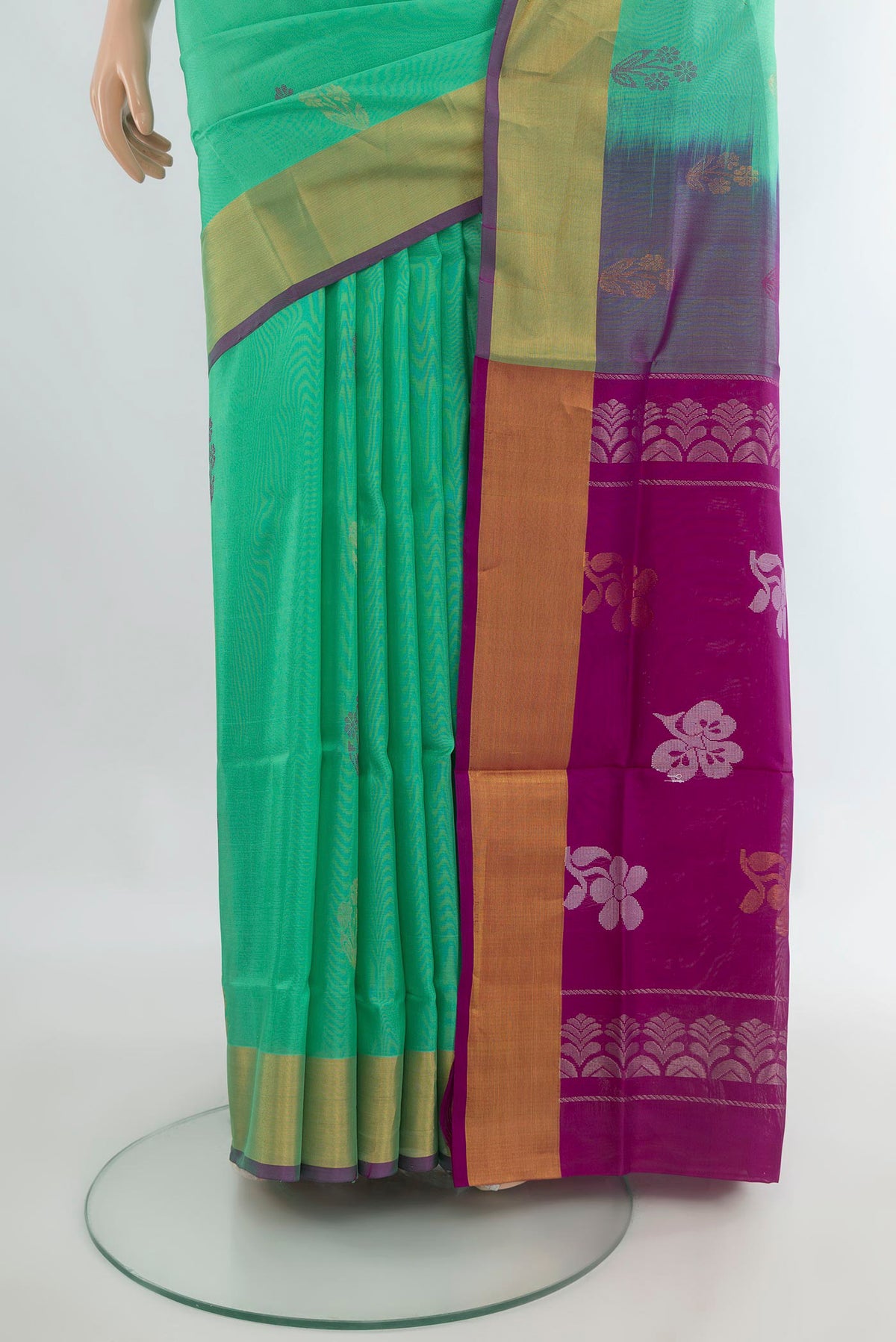 Pleats and pallu of Pure Silk Green Uppada Saree with Zari Butta on the body and Zari Border. 