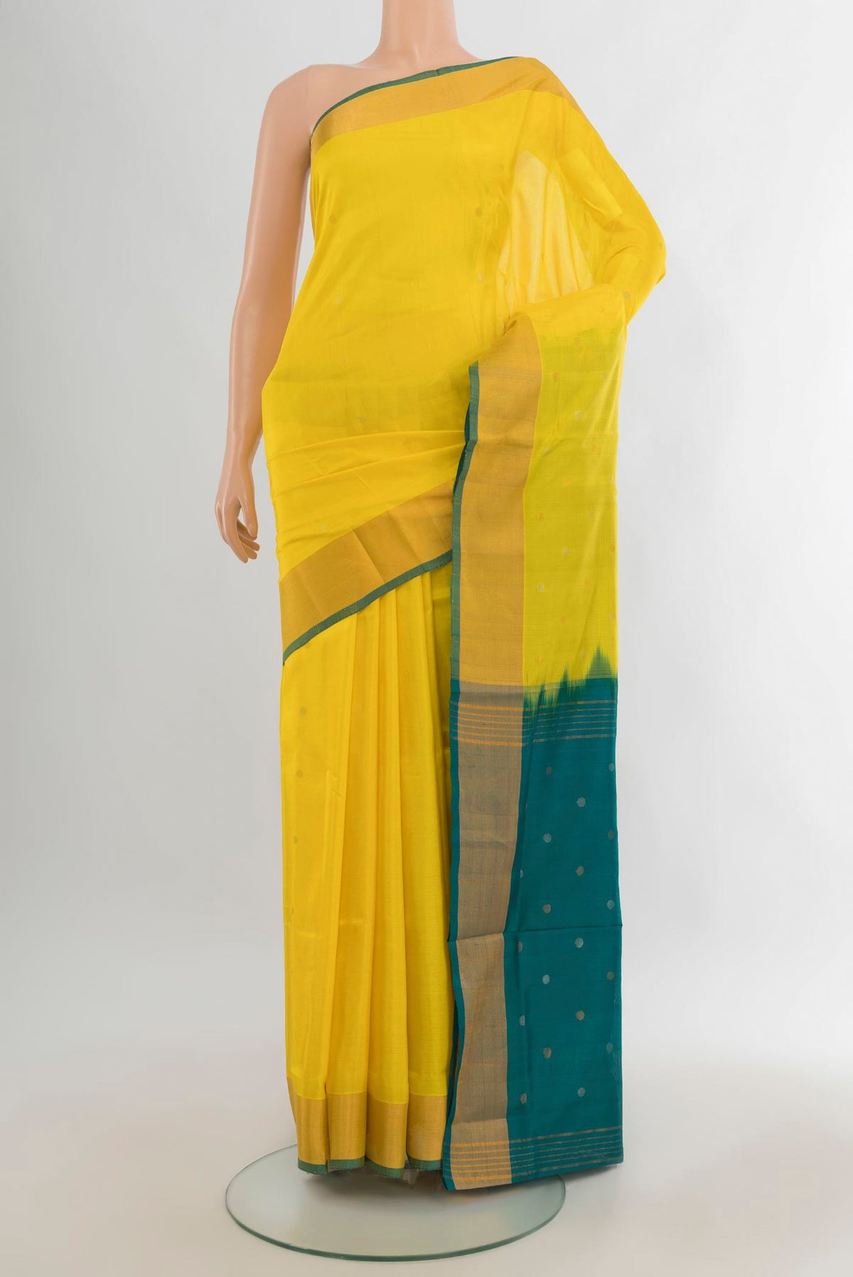 Pure Silk Yellow Uppada Saree with Zari Butta on the body and Zari Border.  displayed on a mannequin