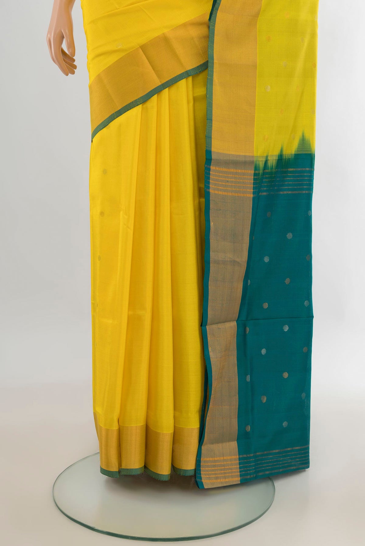 Pleats and pallu of Pure Silk Yellow Uppada Saree with Zari Butta on the body and Zari Border. 