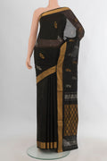 Pure Silk Black Uppada Saree with Zari Butta on the body and Zari Border.  displayed on a mannequin