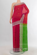 Pure Silk Coral Uppada Saree with Zari Butta on the body and Zari Border.  displayed on a mannequin