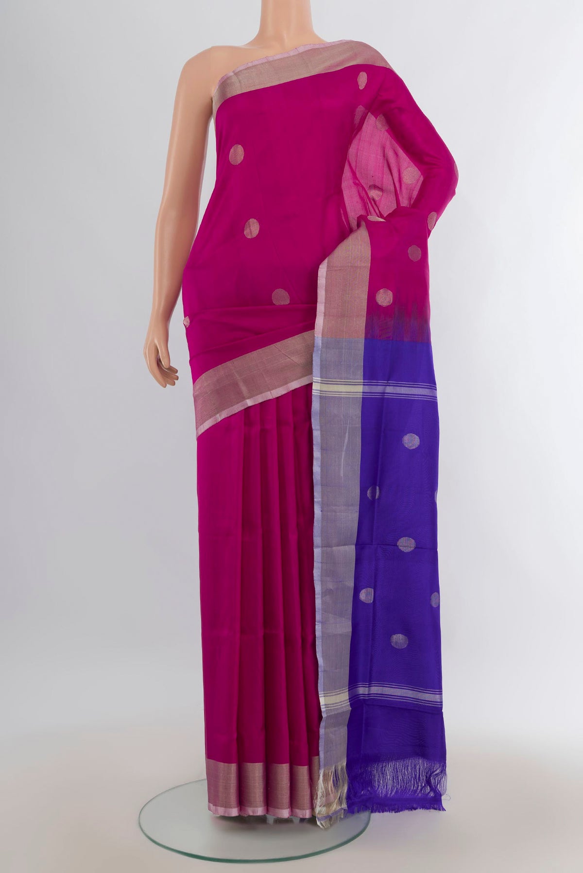 Pure Silk Magenta Uppada Saree with Zari Butta on the body and Silk Border.  displayed on a mannequin