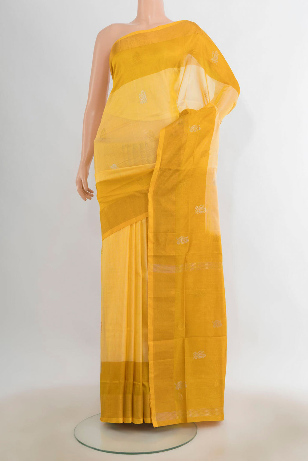 Pure Silk Yellow Uppada Saree with Zari Butta on the body and Zari Border.  displayed on a mannequin