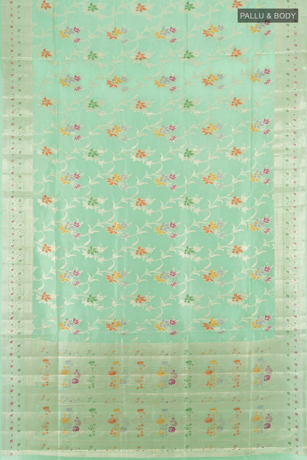 Flat view of Pure Silk Mint Green Banarasi Raw Saree with Zari And Thread Butta on the body and Zari Border. 
