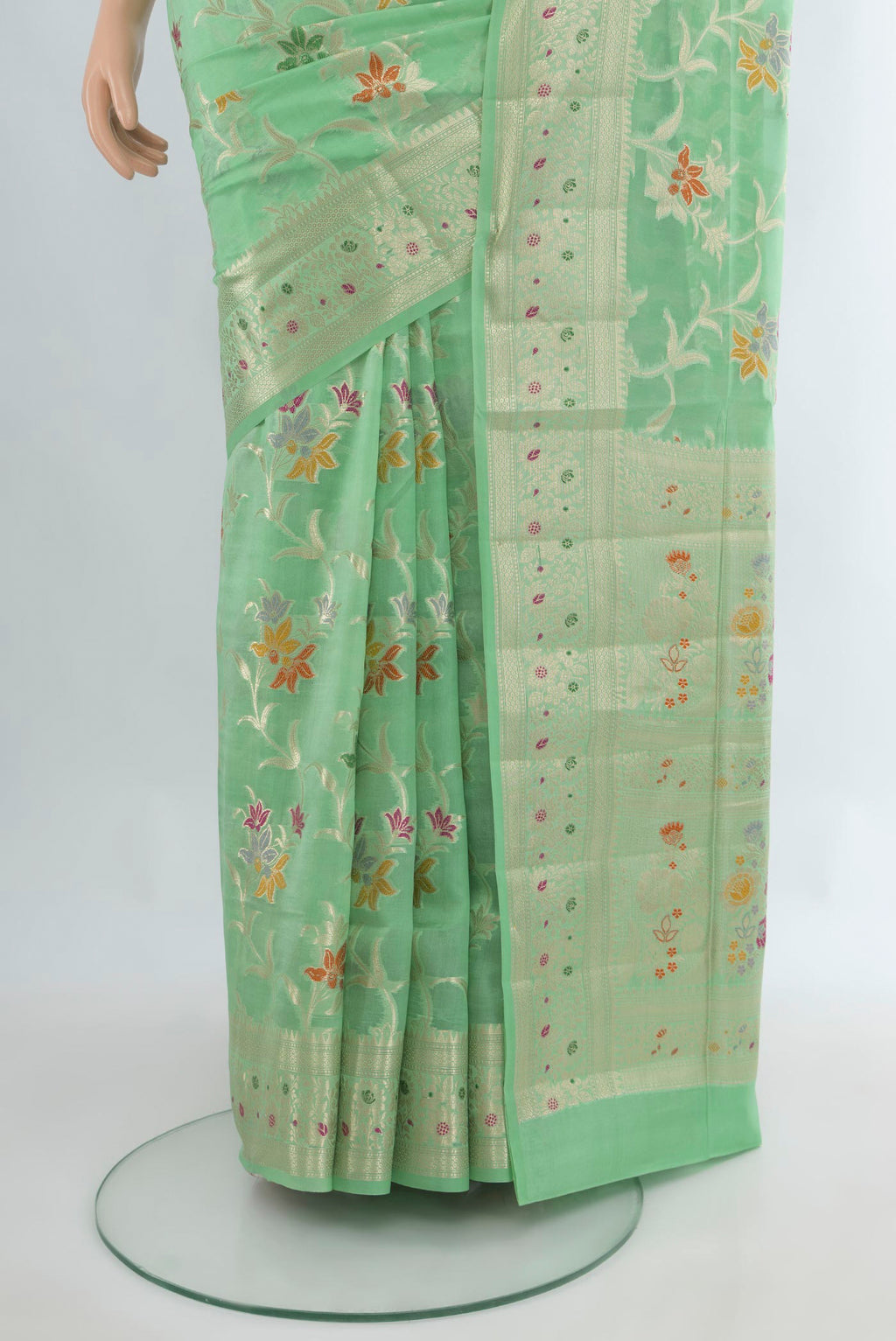 Pleats and pallu of Pure Silk Mint Green Banarasi Raw Saree with Zari And Thread Butta on the body and Zari Border. 