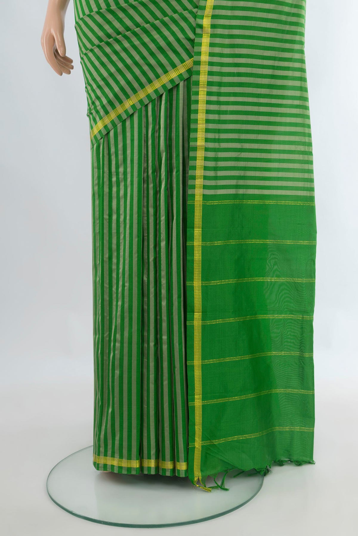 Pleats and pallu of Pure Silk Green Kanchipuram Saree with Stripes on the body and Zari Border. 