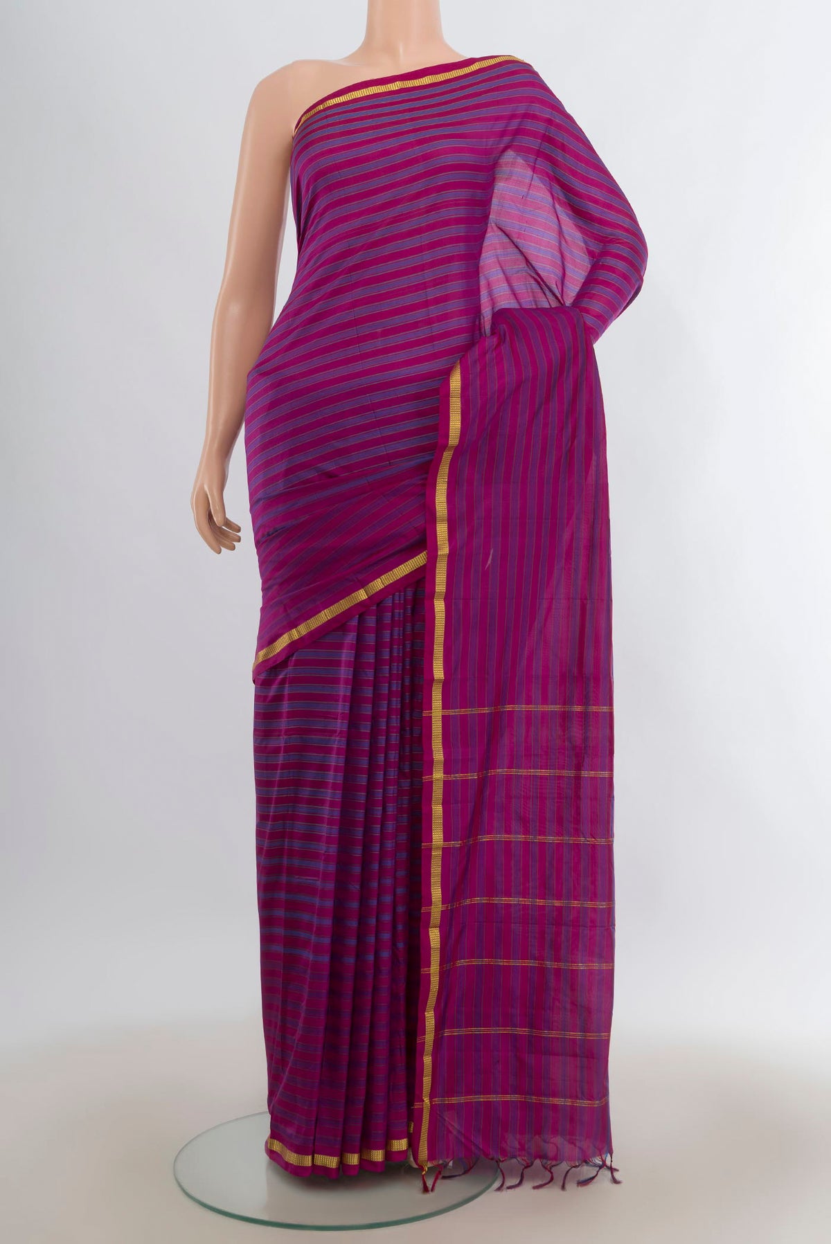 Pure Silk Magenta Kanchipuram Saree with Stripes on the body and Zari Border.  displayed on a mannequin