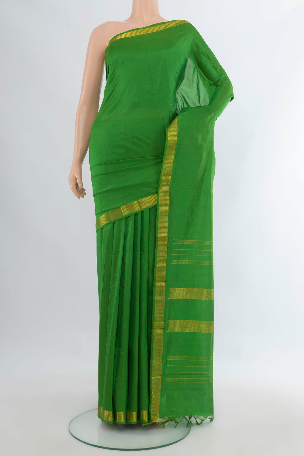 Pure Silk Green Kanjivaram Saree with Plain Body and Zari Border.  displayed on a mannequin