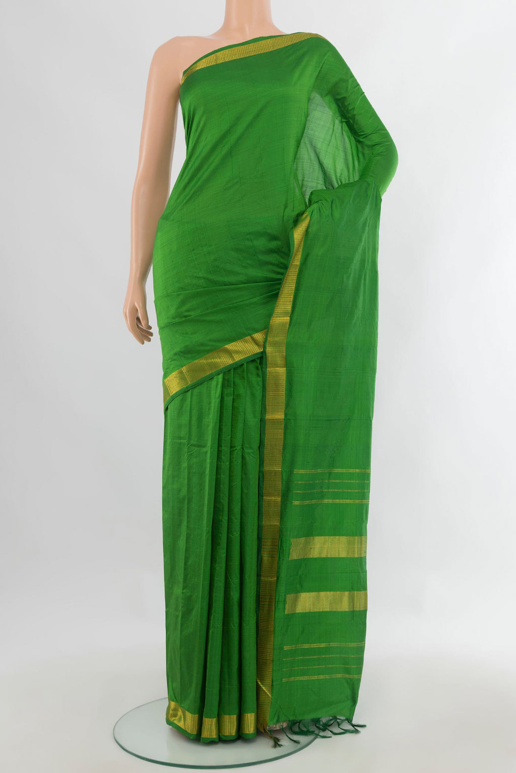 Pure Silk Green Kanjivaram Saree with Plain Body and Zari Border.  displayed on a mannequin