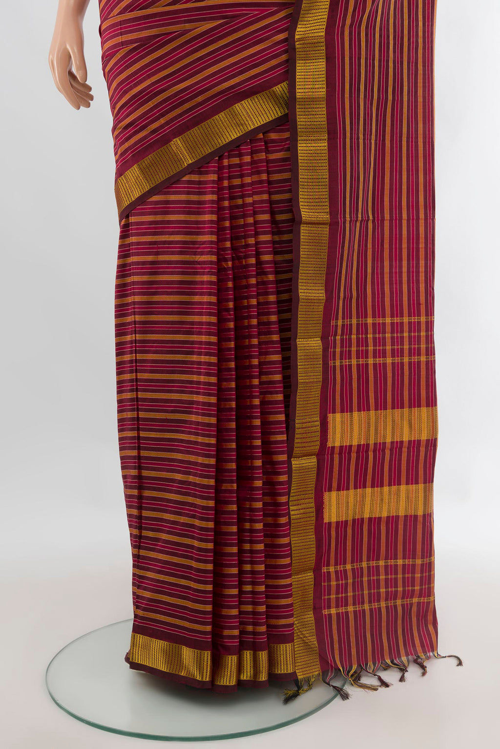 Pleats and pallu of Pure Silk Maroon Kanjivaram Saree with Stripes on the body and Zari Border. 
