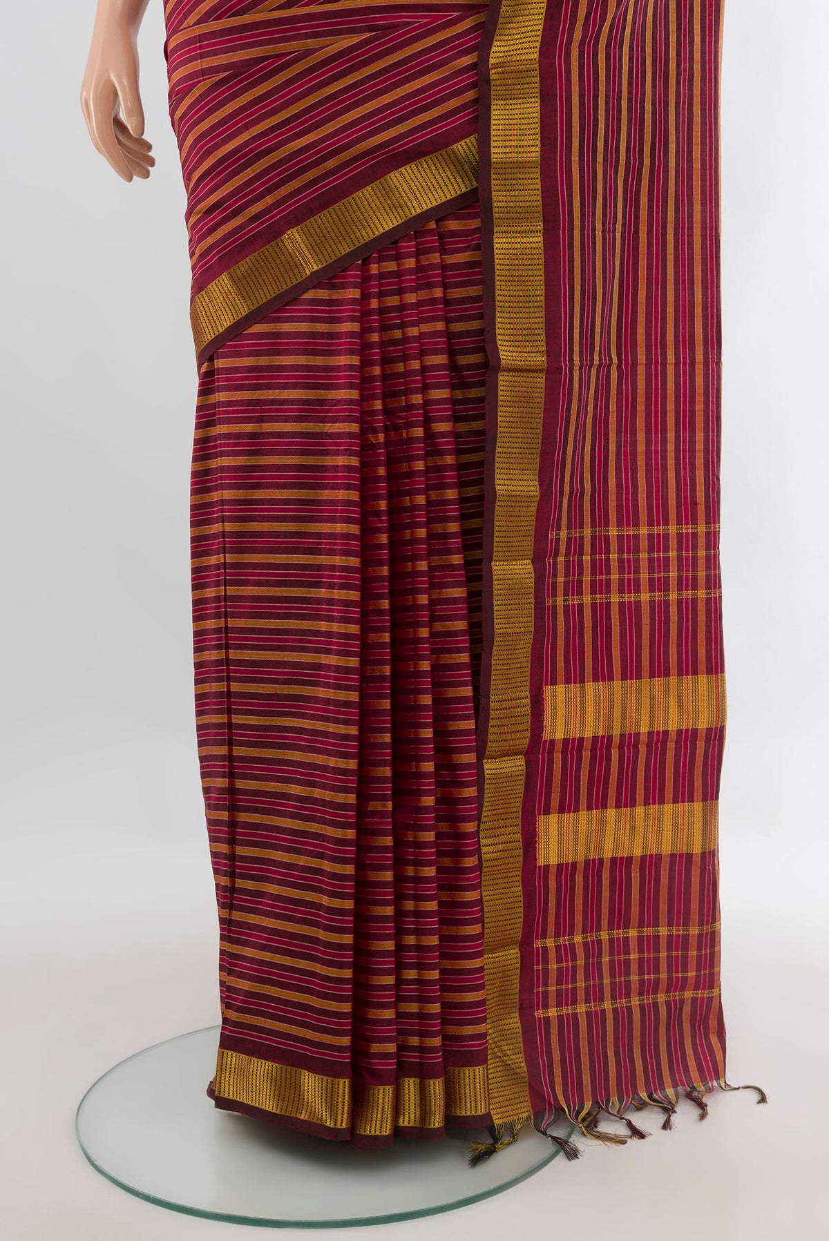 Pleats and pallu of Pure Silk Maroon Kanjivaram Saree with Stripes on the body and Zari Border. 