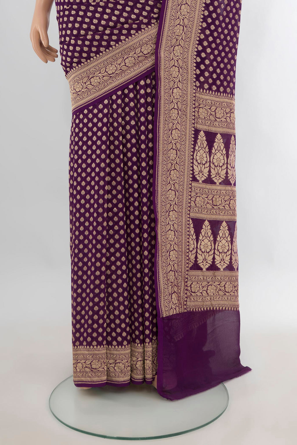 Pleats and pallu of Violet Banarasi Georgette Saree with Zari Butta on the body and Zari Border. 