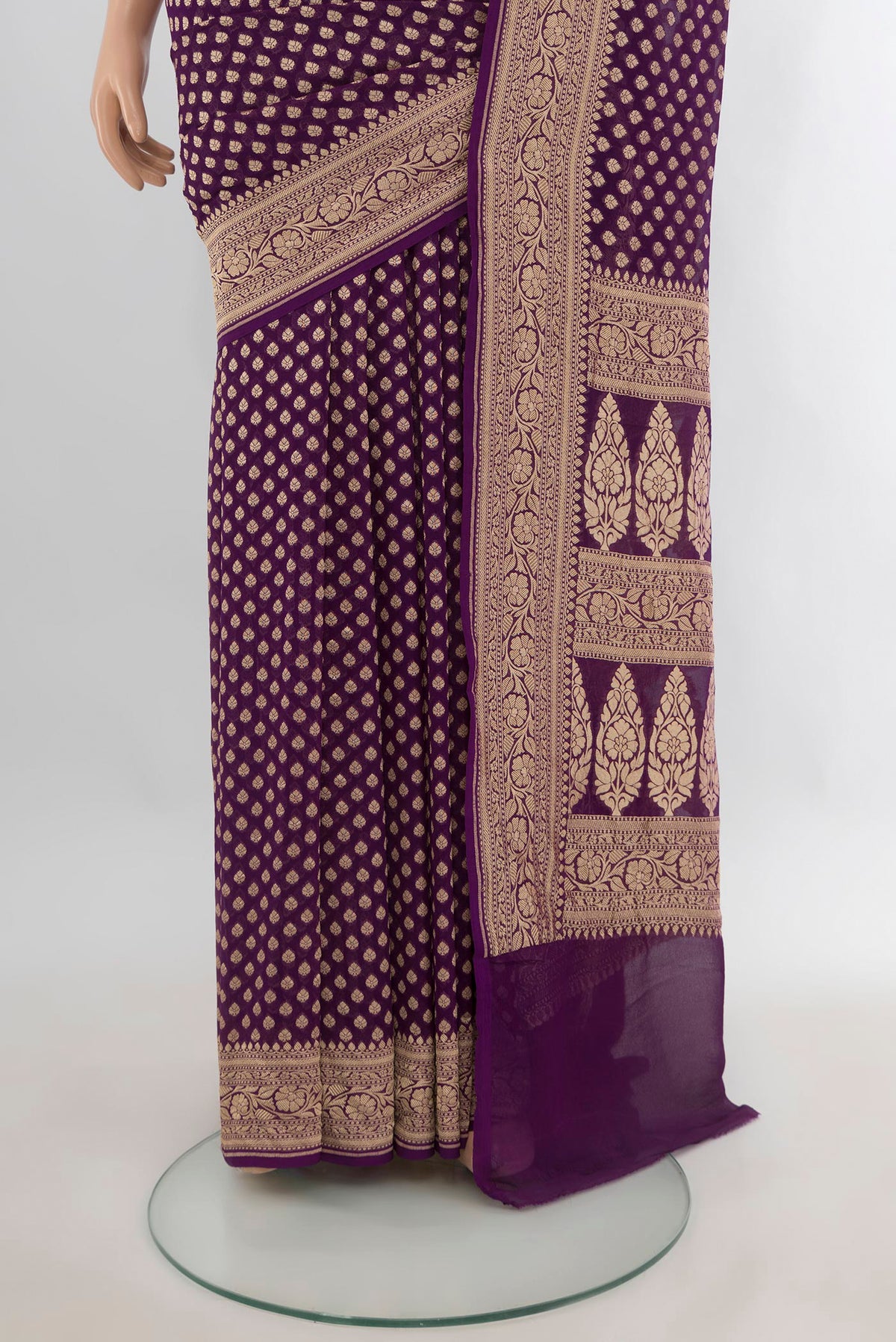 Pleats and pallu of Violet Banarasi Georgette Saree with Zari Butta on the body and Zari Border. 