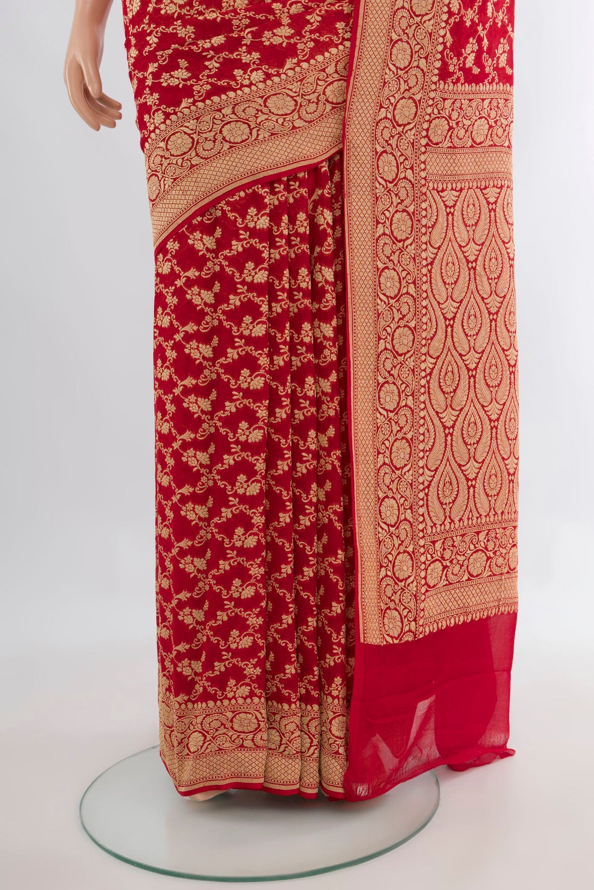 Pleats and pallu of Red Banarasi Georgette Saree with Zari Brocade on the body and Zari Border. 