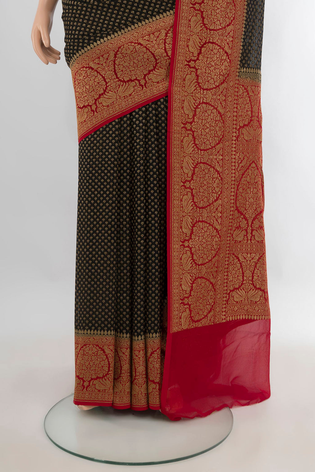 Pleats and pallu of Black Banarasi Georgette Saree with Zari Butta on the body and Zari Border. 