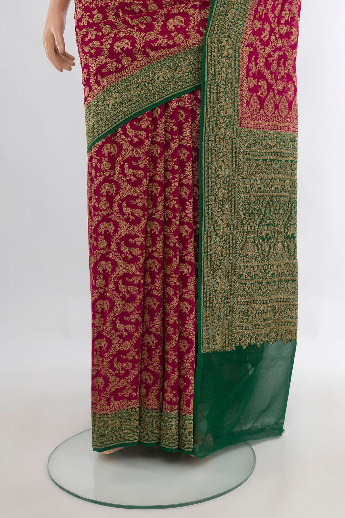 Pleats and pallu of Dark Pink Banarasi Georgette Saree with Zari Brocade on the body and Zari Border. 