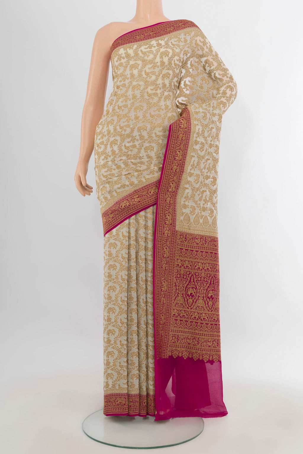 Cream Banarasi Georgette Saree with Zari Butta on the body and Zari Border.  displayed on a mannequin