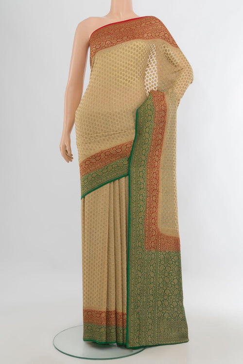 Beige Banarasi Georgette Saree with Zari Brocade on the body and Zari Border.  displayed on a mannequin