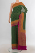 Multi Color Banarasi Georgette Saree with Zari Butta on the body and Silk Border.  displayed on a mannequin