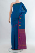 Pure Silk Peacock Blue Kanchipuram Saree with Plain Body and Thread Border.  displayed on a mannequin