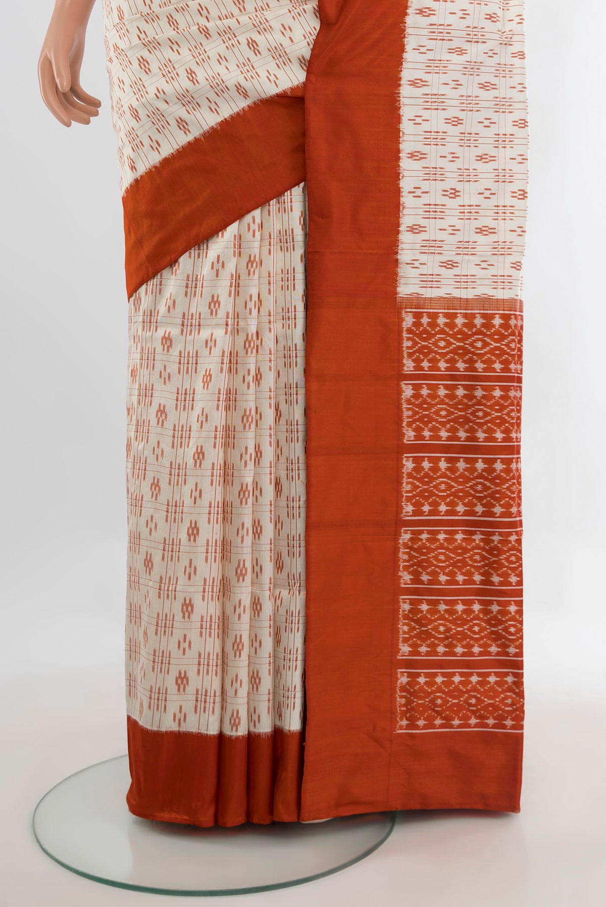 Pleats and pallu of Pure Silk Cream Pochampally Saree with Pure Ikat on the body and Plain Border. 