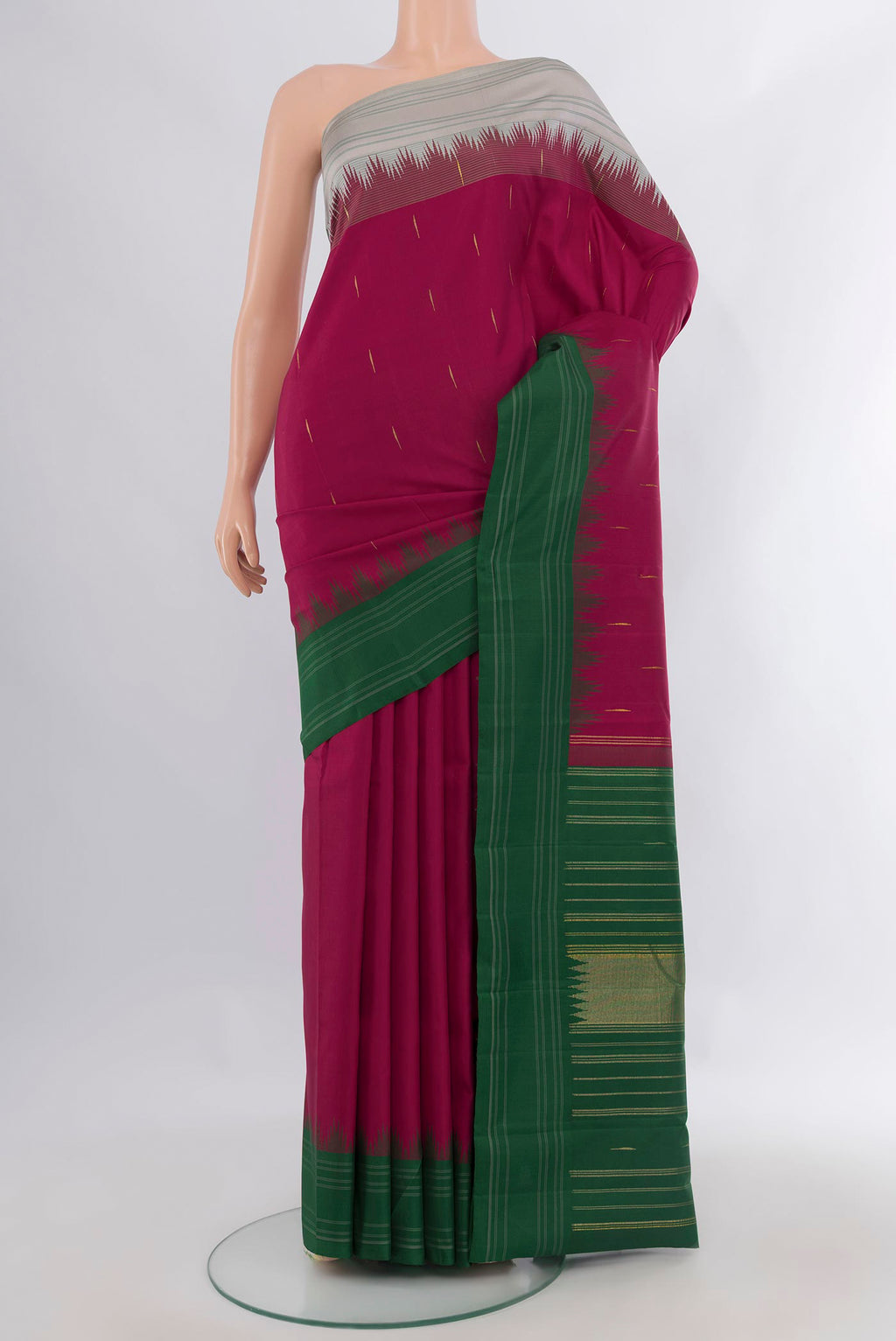 Pure Silk Maroon Kanchipuram Saree with Thread Butta on the body and Temple Border.  displayed on a mannequin