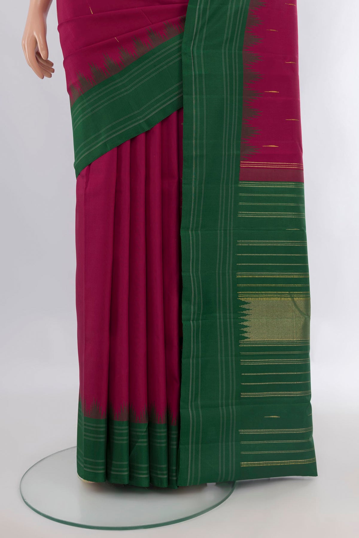 Pleats and pallu of Pure Silk Maroon Kanchipuram Saree with Thread Butta on the body and Temple Border. 