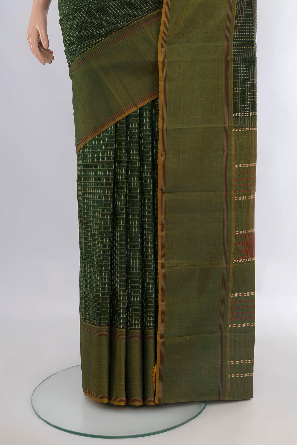 Pleats and pallu of Pure Silk Bottle Green Kanchipuram Saree with Checked design on the body and Plain Border. 