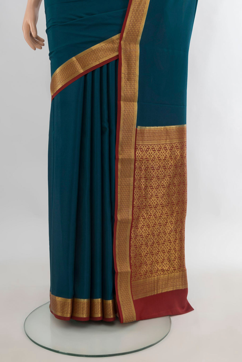 Pleats and pallu of Teal Mysore Crepe Saree with Plain Body and Zari Border. 