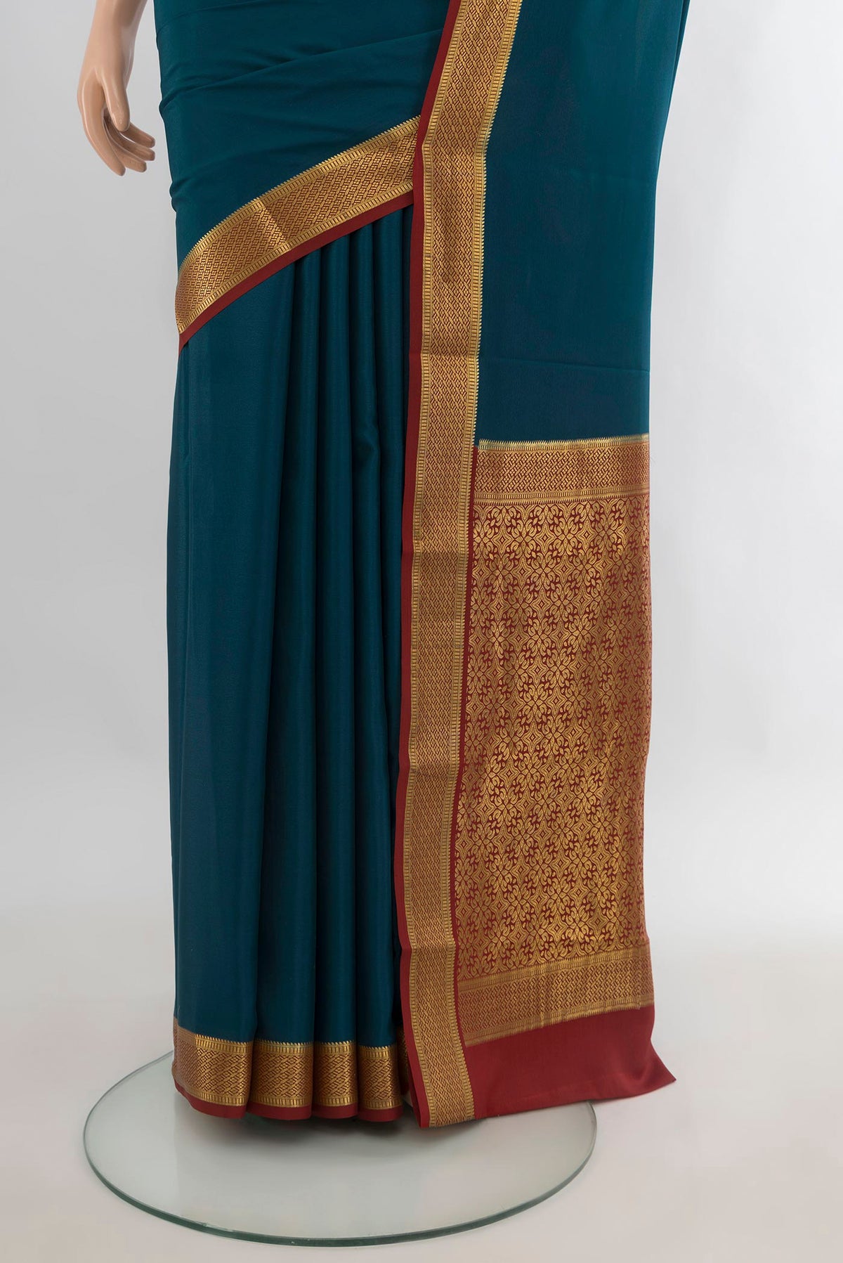 Pleats and pallu of Teal Mysore Crepe Saree with Plain Body and Zari Border. 