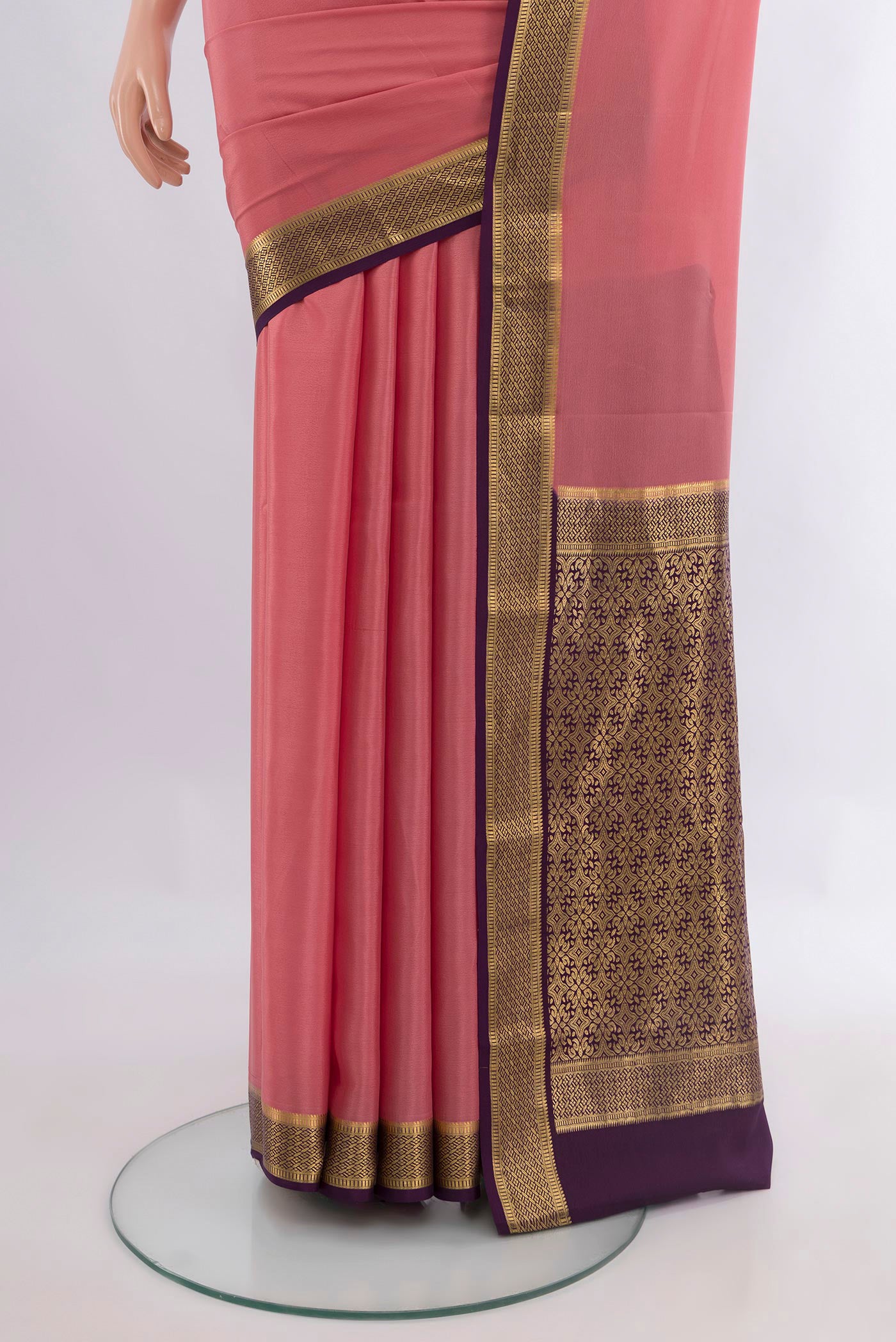 Pleats and pallu of Pink Mysore Crepe Saree with Plain Body and Zari Border. 