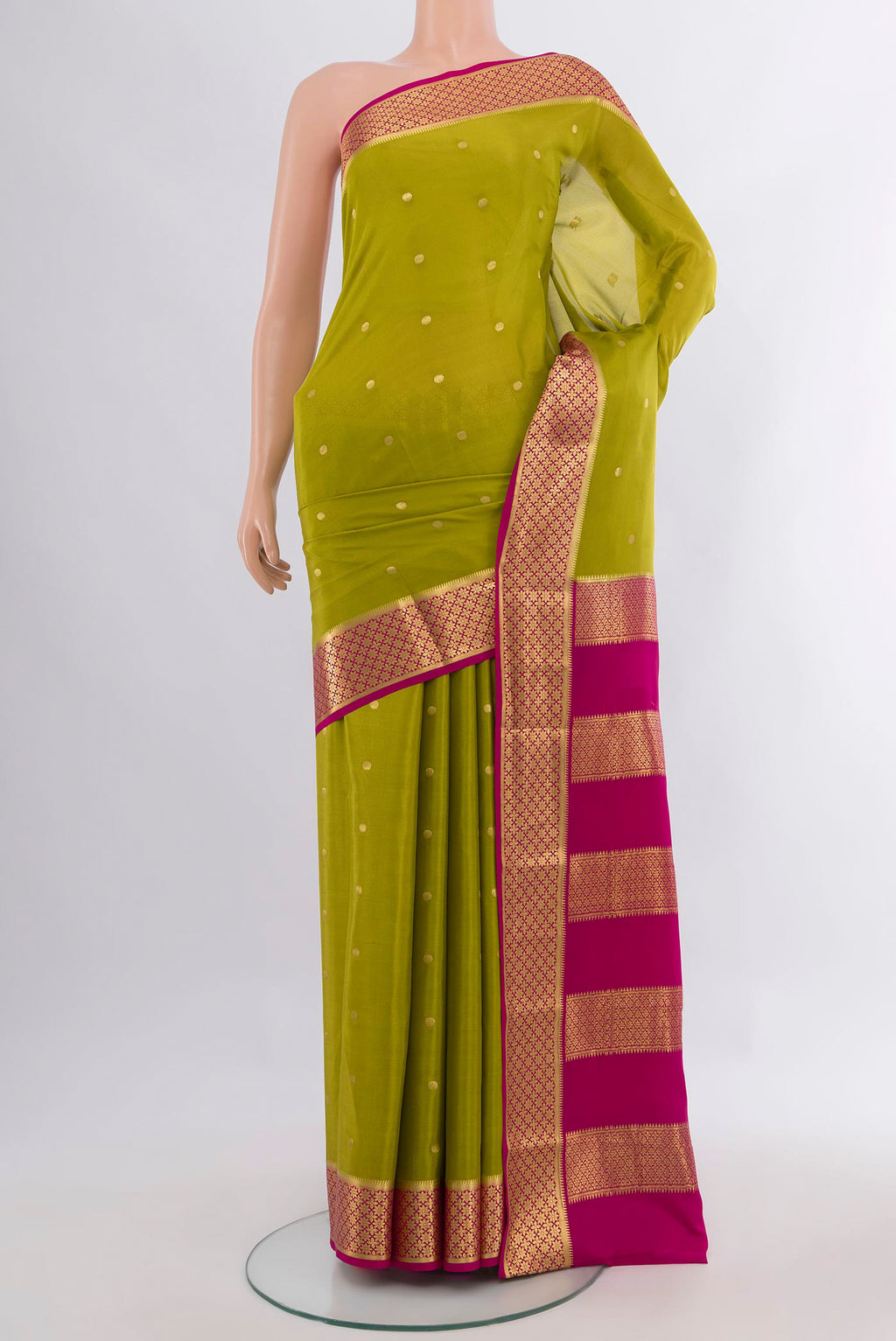 Mehandi Green Mysore Crepe Saree with Zari Butta on the body and Zari Border.  displayed on a mannequin